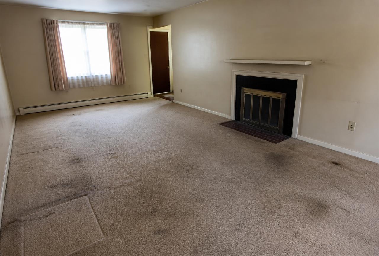 1970s Living Room → White Oak Hardwood — before